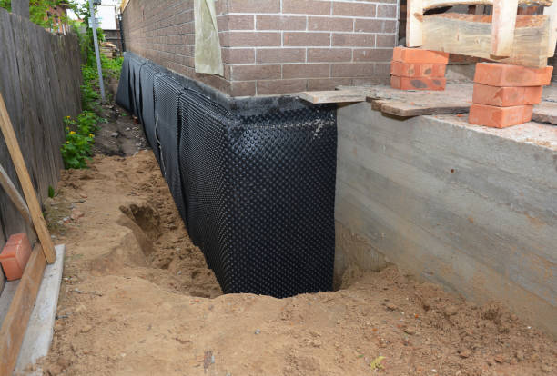 SJ Waterproofing Pros technician performing targeted Exterior Waterproofing assessment in Mentone, AL